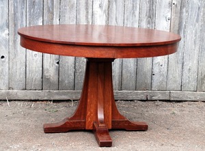 Vintage L.& J.G. Stickley  Antique 48 inch dining table with 4 original leaves in their original leaf rack, signed.